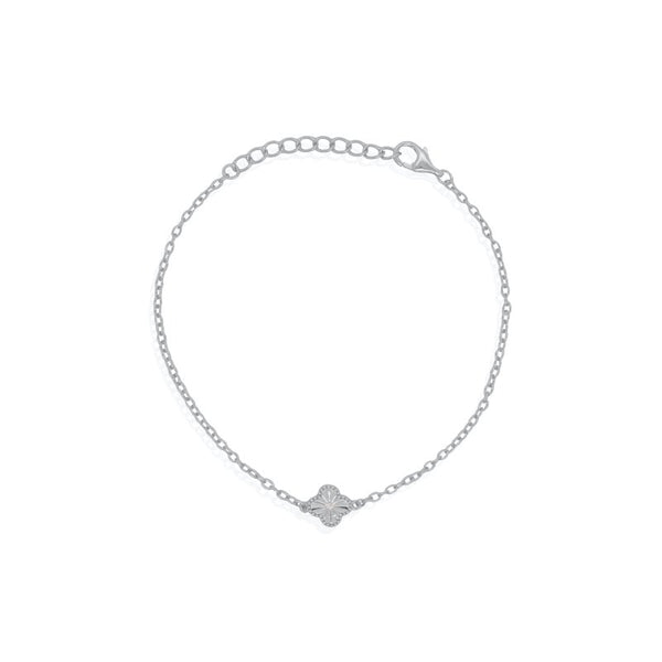 Silver bracelet with a small clover charm on a white background
