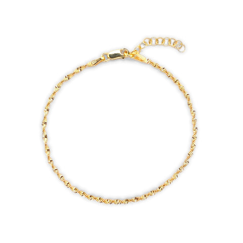 Gold bracelet on a white background