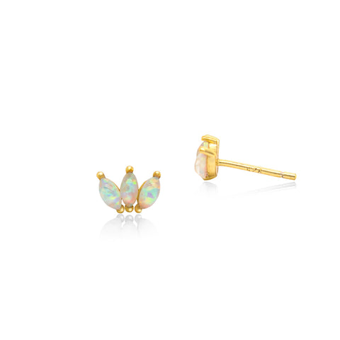 Gold earrings with opal stones on a white background