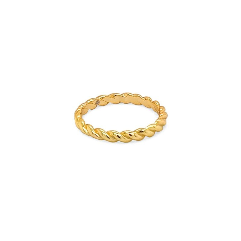Gold ring with a twisted design on a white background