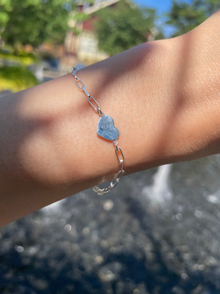 Silver paperclip chain bracelet with a heart charm 