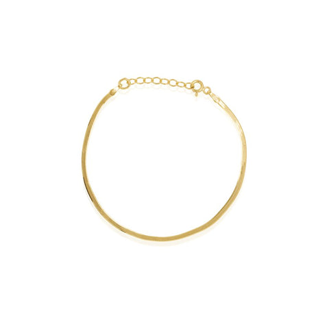 Gold bracelet on a white background