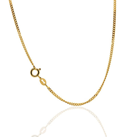 Gold chain necklace on a white background