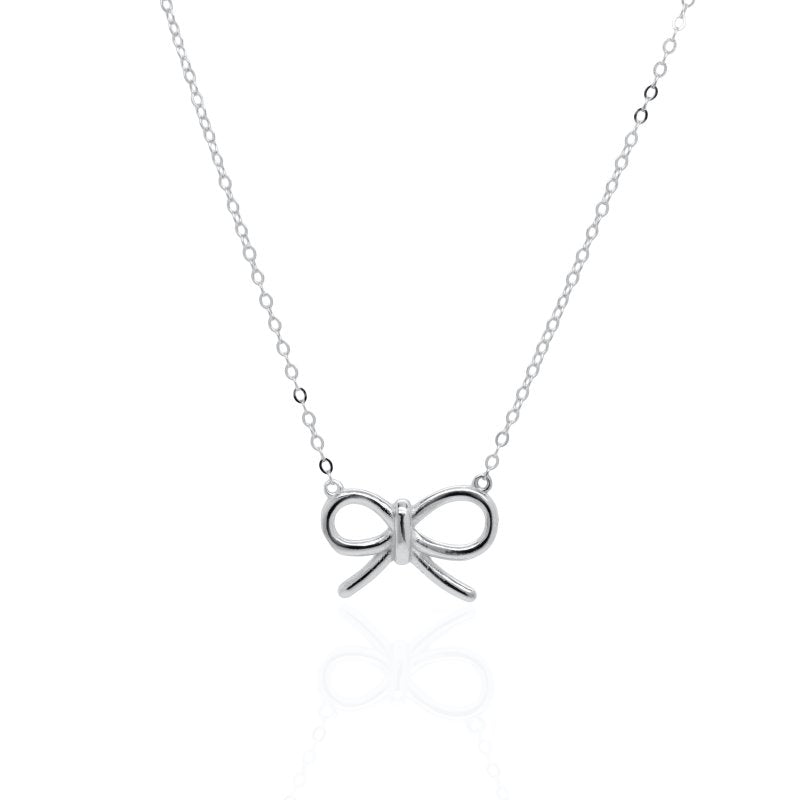 Silver bow-shaped pendant on a chain against a white background