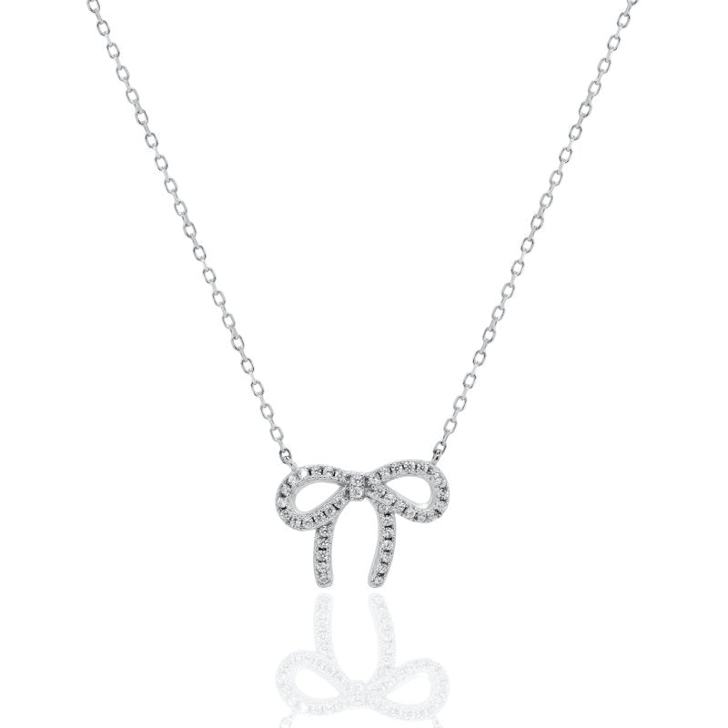 Silver bow-shaped pendant necklace on a white background