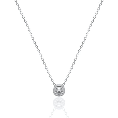Silver necklace with a small round diamond bezel pendant on a white background